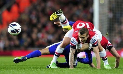 Arsenal midfielder Jack Wilshere (R) and Everton's Steven Pienaar are pictured during their match on April 16, 2013