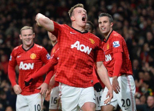 Manchester United defender Phil Jones (C) is pictured during their Premier League match against City on April 8, 2013