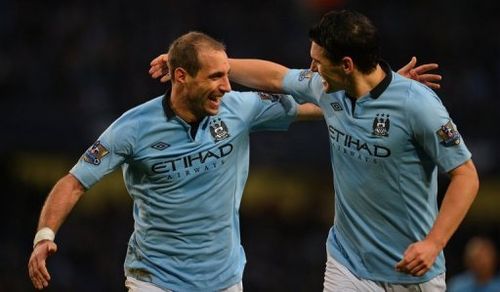 Manchester City's Pablo Zabaleta (L) and Gareth Barry are pictured during a Premier League match on January 1, 2013