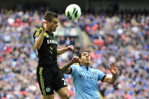 Chelsea's Cesar Azpilicueta (L) and Man City's Carlos Tevez are pictured during their FA Cup match on April 14, 2013