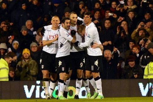 Fulham's Dimitar Berbatov (C) celebrates after scoring during their Premier League match against QPR on April 1, 2013