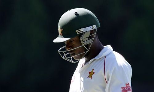 Zimbabwe's Vusi Sibanda walks off after losing his wicket at the Harare Sports Club on April 17, 2013