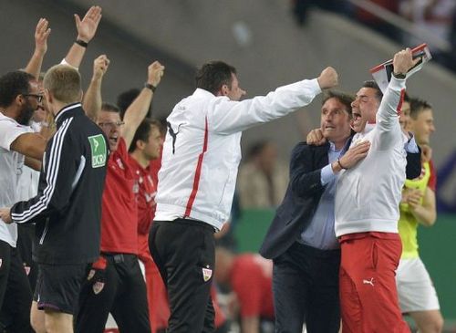 Stuttgart's headcoach Bruno Labbadia (C) reacts with team members in Stuttgart, southern Germany, on April 17, 2013