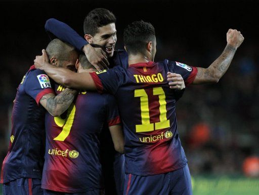 Barcelona&#039;s players celebrate after scoring against Mallorca, at the Camp Nou stadium in Barcelona, on April 6, 2013