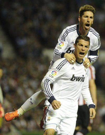 Real Madrid&#039;s Cristiano Ronaldo and Sergio Ramos celebrate after scoring against Bilbao, on April 14, 2013