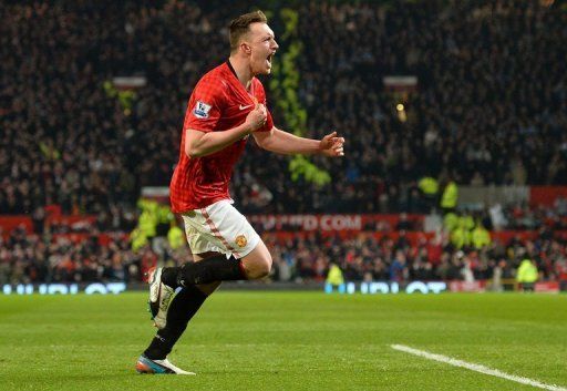 Manchester United defender Phil Jones celebrates his part in the equaliser against Manchester City on April 8, 2013