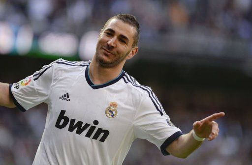 Real Madrid&#039;s forward Karim Benzema celebrates after scoring in Madrid on April 20, 2013