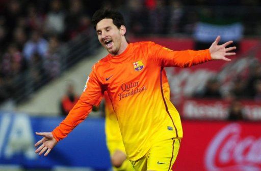 Barcelona&#039;s Lionel Messi celebrates after scoring in Granada on February 16, 2013