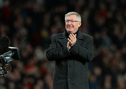 Manchester United manager Alex Ferguson celebrates after his team won the Premier League title on April 22, 2013