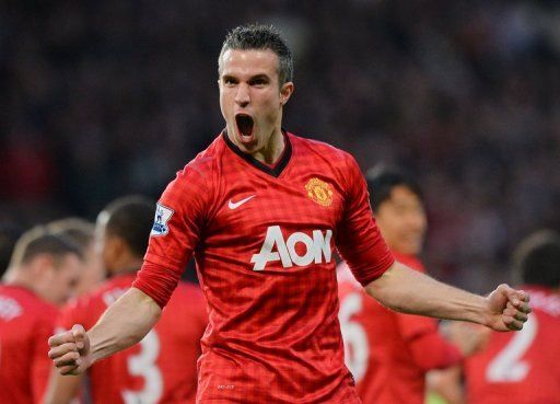 Manchester United&#039;s Robin van Persie celebrates after scoring during their match against Aston Villa on April 22, 2013