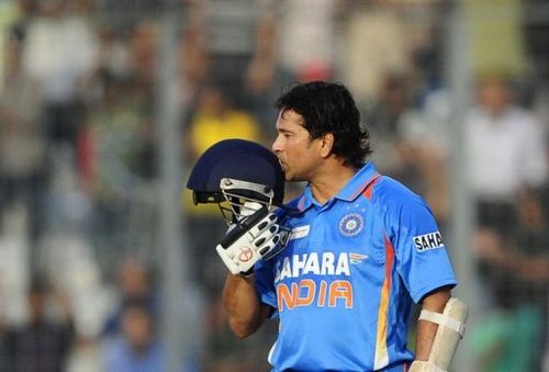 Sachin Tendulkar kisses his helmet after scoring his 100th century on March 16, 2012