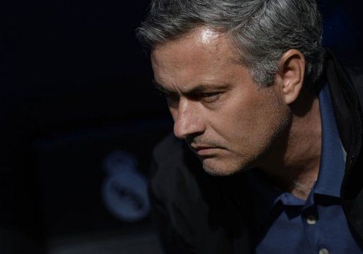 Real Madrid&#039;s coach Jose Mourinho looks on before a match at the Santiago Bernabeu stadium in Madrid on April 20, 2013