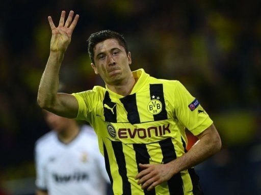 Dortmund&#039;s striker Robert Lewandowski celebrates after scoring a penalty on April 24, 2013 in Dortmund