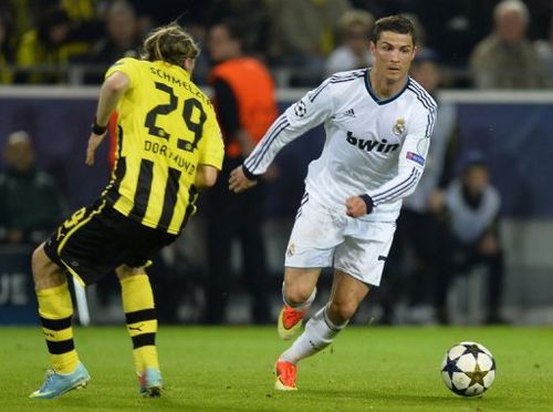 Real Madrid's Cristiano Ronaldo (R) is pictured during their Champions League match against Dortmund on April 24, 2013