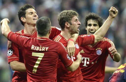 Bayern Munich&#039;s midfielder Thomas Mueller (2dR) against Barcelona on April 23, 2013 in Munich, Germany