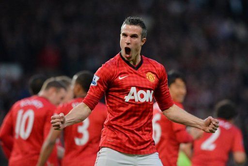 Manchester United striker Robin van Persie celebrates scoring his team&#039;s first goal against Aston Villa on April 22, 2013