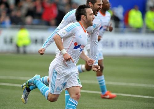 Marseille's midfielder Mathieu Valbuena (C) celebrates after scoring on April 27, 2013 in Lorient