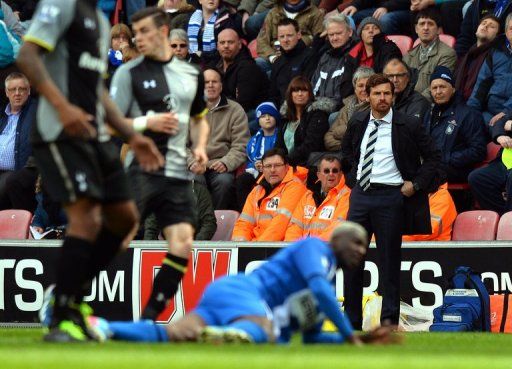 Tottenham manager Andre Villas-Boas watches his side from the sidelines draw 2-2 at Wigan on April 27, 2013