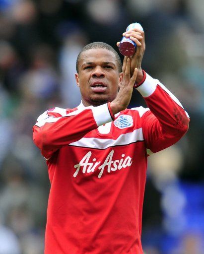 QPR striker Loic Remy applauds the fans after the 0-0 draw at Reading on April 28, 2013