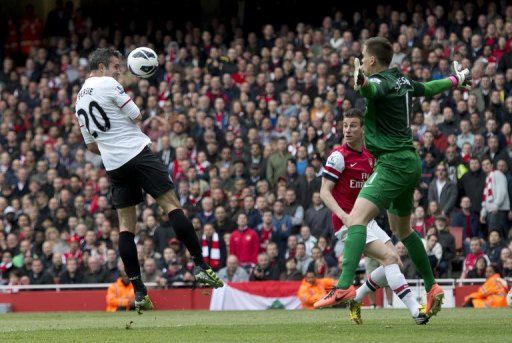 Robin van Persie has his header saved by Arsenal goalkeeper Wojciech Szczesny on April 28, 2013