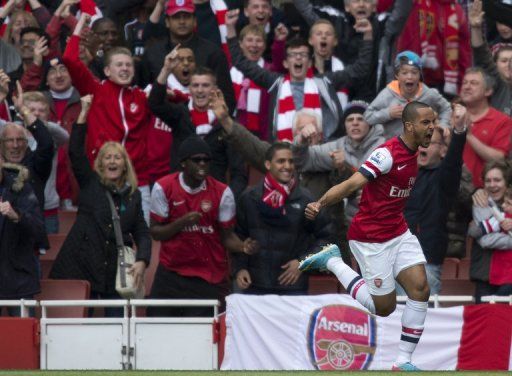 Theo Walcott streaks away after scoring to put Arsenal ahead against Manchester United on April 28, 2013