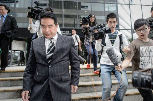 Birmingham City owner Carson Yeung (L) leaves the Wanchai district court in Hong Kong on April 29, 2013