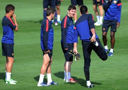 Lionel Messi (2ndR) during a training session on April 30, 2013, the eve of the UEFA Champions League semi-final