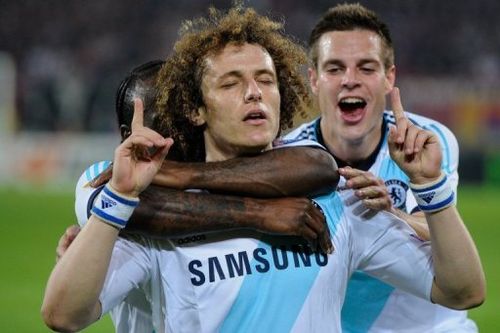 Chelsea's David Luiz (C) is congratulated by teammates after scoring during their match against Basel on April 25, 2013