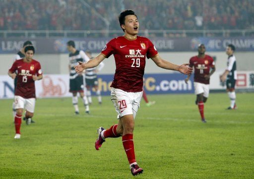 Guangzhou Evergrande&#039;s Gao Lin celebrates after scoring against Thailand Muangthong United on April 3, 2013