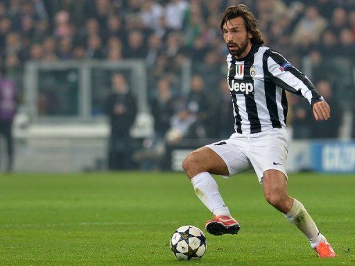 Juventus&#039; Andrea Pirlo controls the ball during a UEFA Champions League match in Turin on April 10, 2013