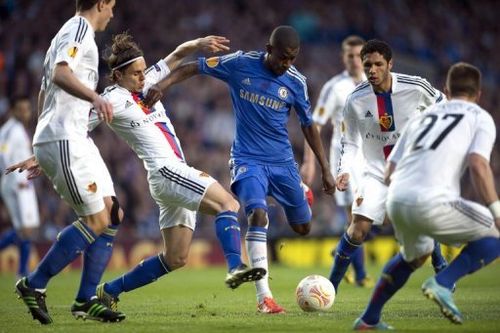 FC Basel defender Kay Voser (2nd L) tries to block Chelsea's Ramires during their Europa League match on May 2, 2013