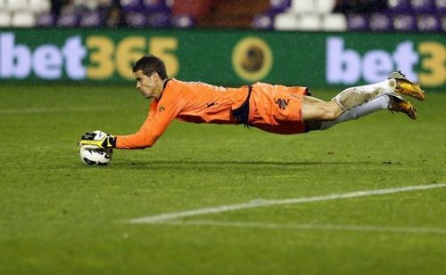 Valladolid's goalkeeper Daniel Hernandez catches the ball during the match against Malaga in Valladolid on March 9, 2013