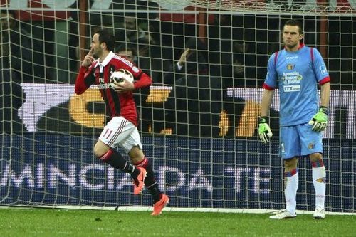 AC Milan's Giampaolo Pazzini (L) celebrates after scoring during a Serie A match against  Catania on April 28, 2013