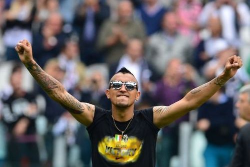 Juventus' Arturo Vidal celebrates winning the Scudetto on May 5, 2013 at the Alps stadium in Turin