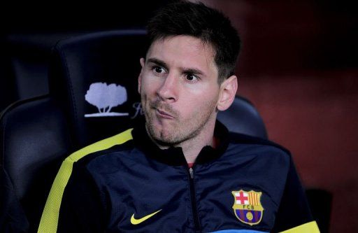 Barcelona&#039;s Lionel Messi grimaces as he sits on the bench at the Camp Nou stadium in Barcelona on May 5, 2013