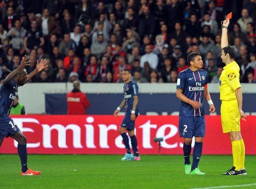 Paris&#039; Thiago Silva (2nd R) receives a red card from French referee Marc-Gerard Biolchini in Paris on May 5, 2013