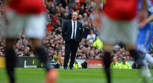 Chelsea interim manager Rafael BenÃ­tez (C) looks on during a match against Manchester United, May 5, 2013