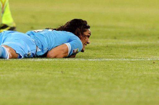 Napoli&#039;s Edinson Cavani reacts in Bologna on May 8, 2013