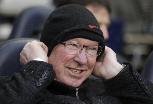 Manchester United  manager Alex Ferguson awaits kick off during a Premier League match against Spurs, January 20, 2013