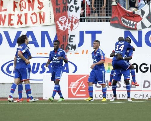 Lyon's players celebrate after scoring a goal in the match against Nancy, May 5, 2013 in Tomblaine