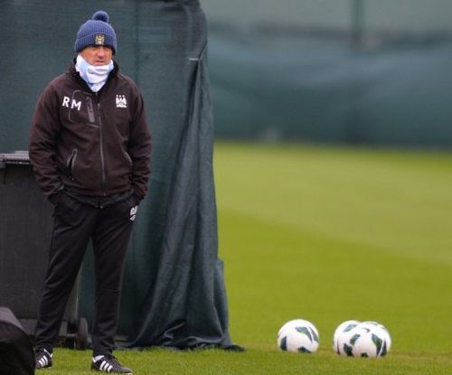 Manchester City manager Roberto Mancini attends a training session on May 10, 2013