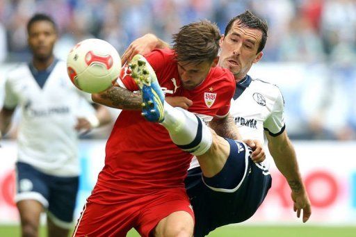 Stuttgart&#039;s Martin Harnik (L) and Schalke&#039;s Christian Fuchs fight for the ball in&Acirc;&nbsp;Gelsenkirchen,&Acirc;&nbsp;May 11, 2013