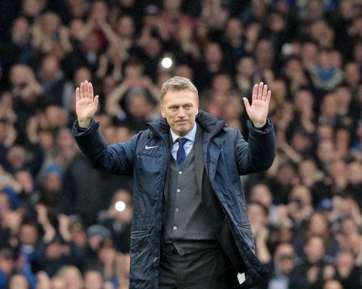 Everton manager David Moyes acknowledges their fans after their 2-0 win against West Ham United on May 12, 2013