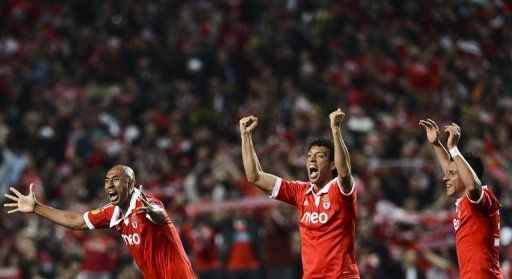 Benfica&#039;s (L-R) Luis Da Silva, Roderick Miranda and Enzo Perez celebrate their victory over Fenerbahce on May 2, 2013