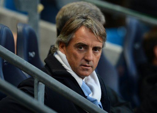 Roberto Mancini watches Manchester City play Swansea at the Etihad Stadium on October 27, 2012