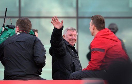 Alex Ferguson on the champions&#039; bus outside Old Trafford before the victory parade in Manchester on May 13,  2013