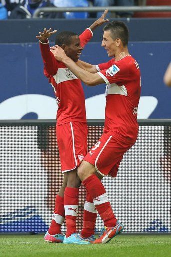 Stuttgart&#039;s Vedad Ibisevic and Ibrahima Traore (L) celebrate scoring against Schalke in&Acirc;&nbsp;Gelsenkirchen,&Acirc;&nbsp;May 11, 2013