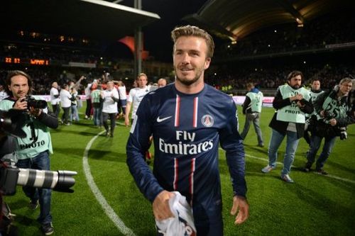 Paris Saint-Germain's David Beckham celebrates after PSG won the French Ligue 1 title, in Lyon, on May 12, 2013