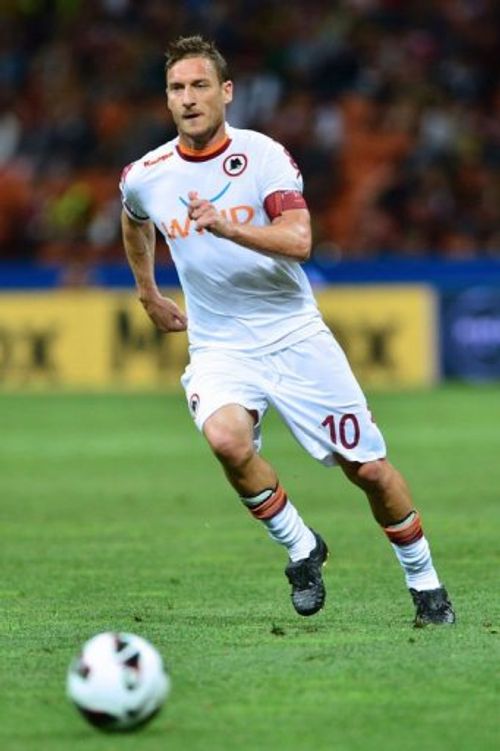 AS Roma's forward Francesco Totti runs for the ball in the match against AC Milan in Milan  on May 12, 2013