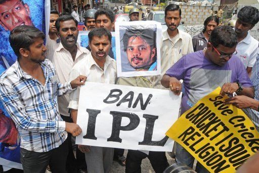 Demonstrators protest against Indian cricketer Shanthakumaran Sreesanth, in Bangalore, on May 16, 2013